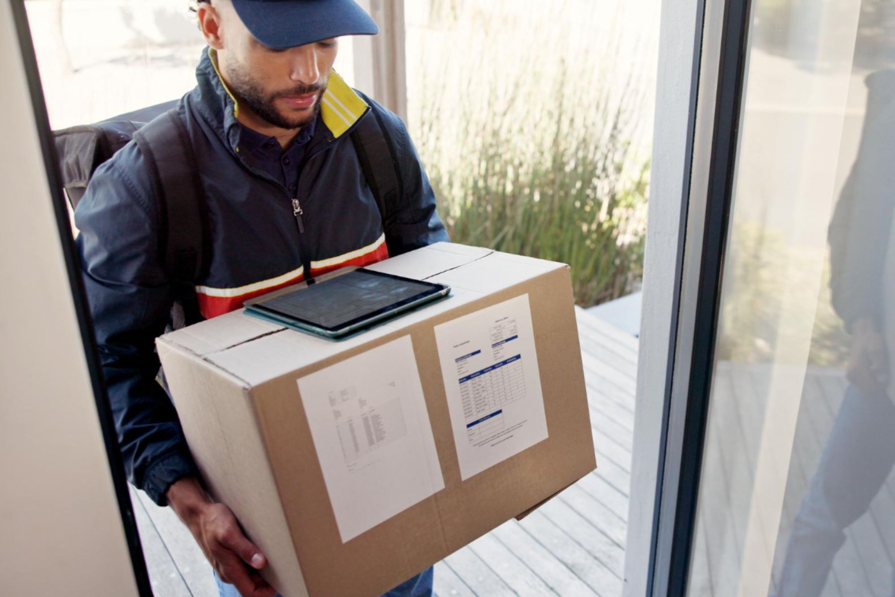 Stop courier with package heading to shipping center