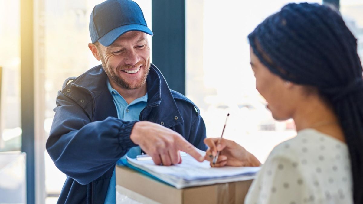 international courier helping woman with package