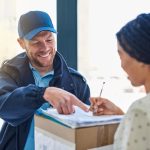 international courier helping woman with package